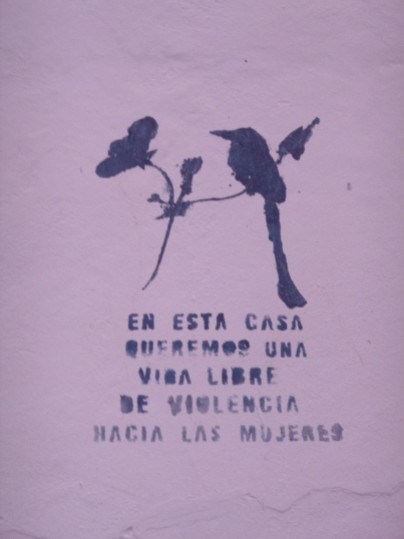 El Salvador, painting on a house, words to fight against woman violence